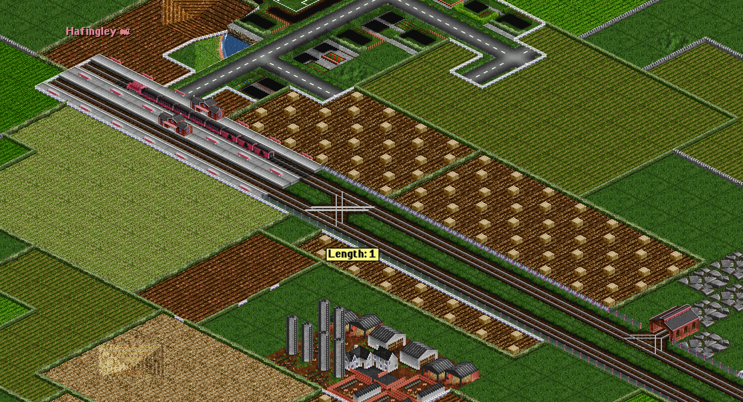 Crossing tracks in front of a station